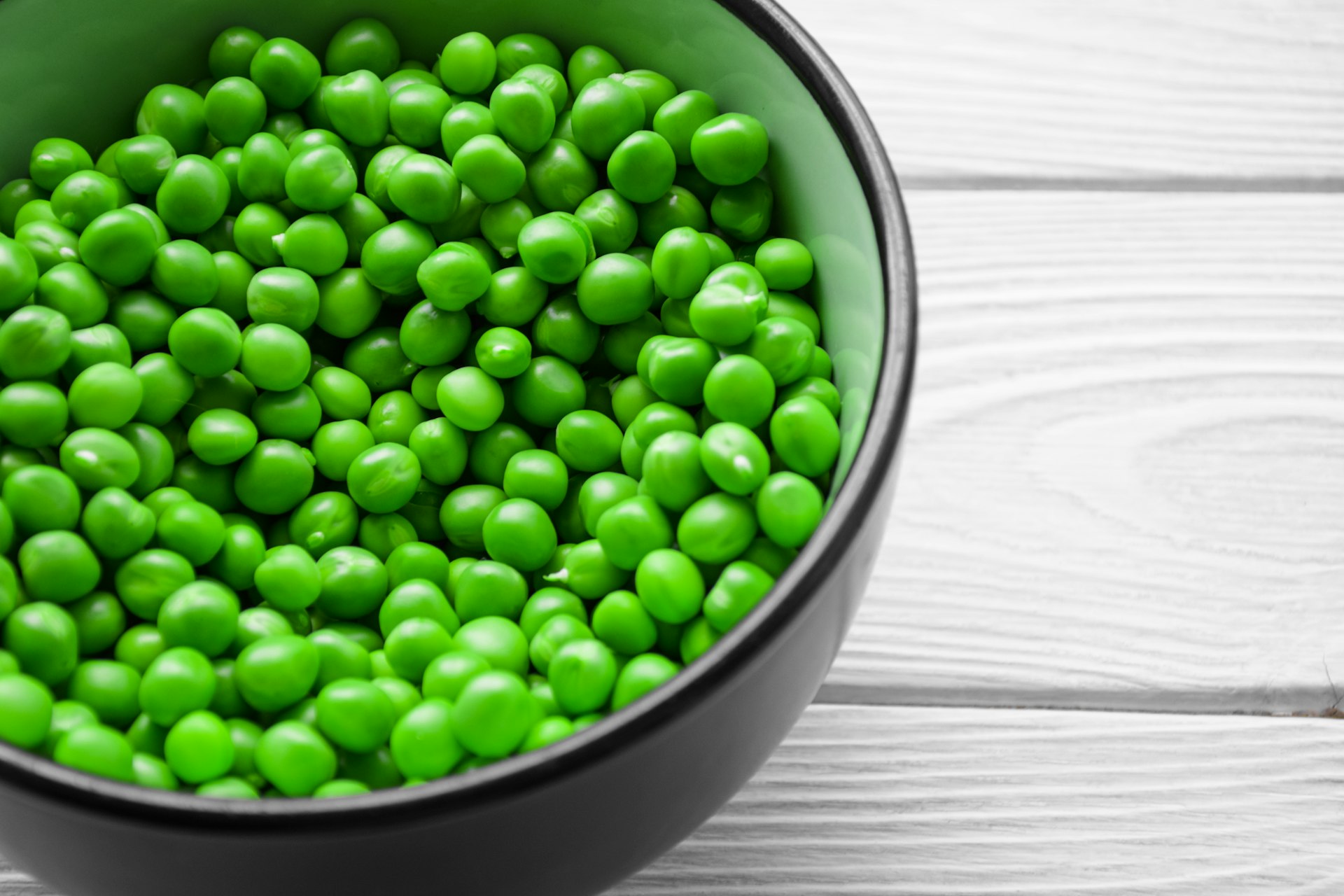 a bowl filled with green peas